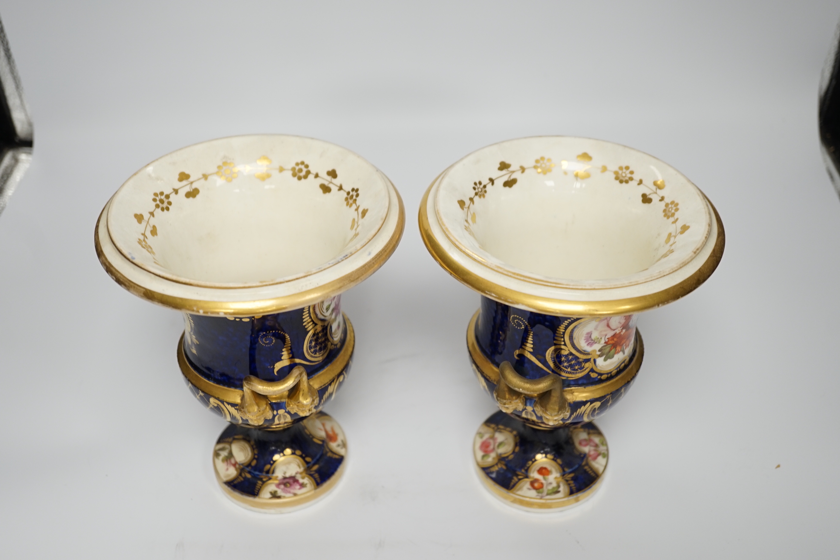 A pair of early 19th century English porcelain vases, scale blue ground, 19cm